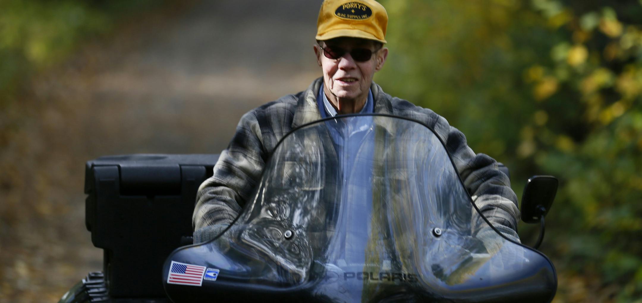It's all about spending time outdoors, with friends. For over 30 years "Bobber" Bob Reed of Cotton has been leading a group of retired ATV enthusiasts on a trail ride every Tuesday. The group that gathers every Tuesday in the parking lot of the WIlbert Cafe in Cotton at 7 a.m., can range from a half dozen to over 30 riders. On this day, there were a dozen, the youngest, Bob Brown, 65 of Pike Lake, MN, the oldest, the "fearless leader" Bob Reed at 87. Here, another youngster in the group is Kenny