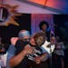 Vocalist Julius Collins embraced Lisa Franze, widow of co-founder Billy Franze, during Dr. Mambo Combo’s first set at Hook & Ladder Sunday night. Th