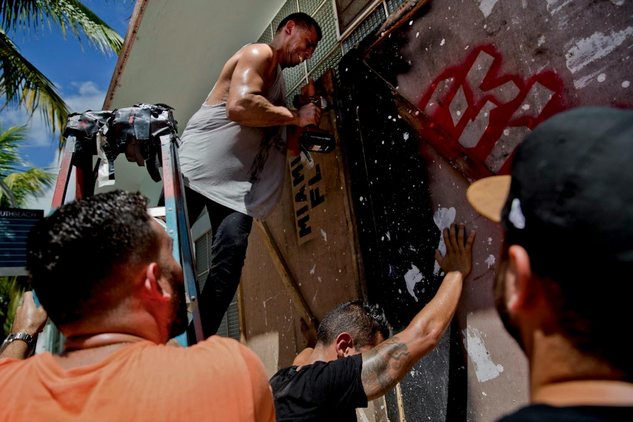 Senor Frog's employees board up the bar's windows in Miami Beach, Fla., Sept. 7, 2017. Hurricane Irma is expected to be Category 4 when it makes landfall in Florida early Saturday, but the possibility of its having a major impact on the state has increased, the National Hurricane Center said.