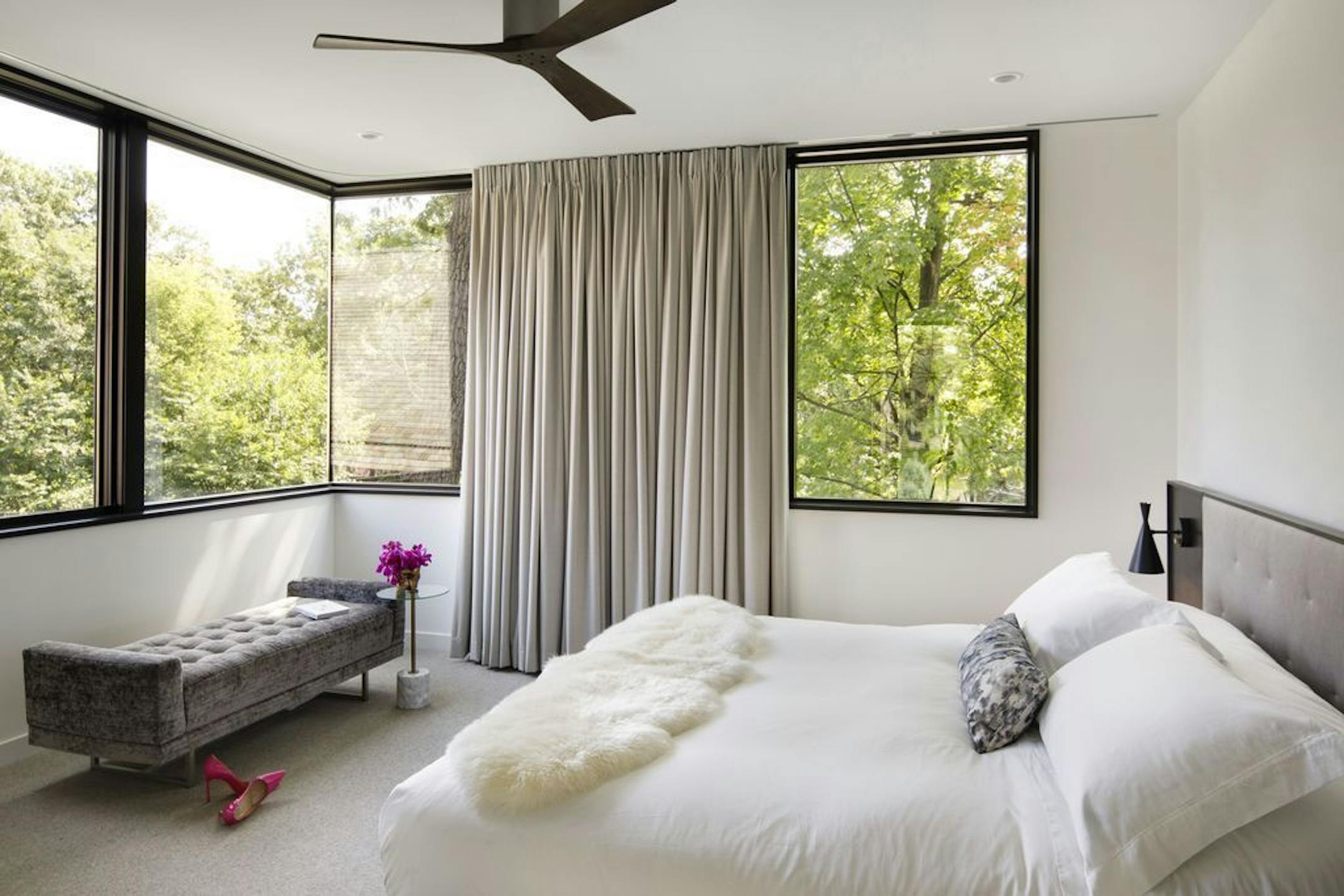 The second story owners' bedroom boasts treetop views from big corner windows.