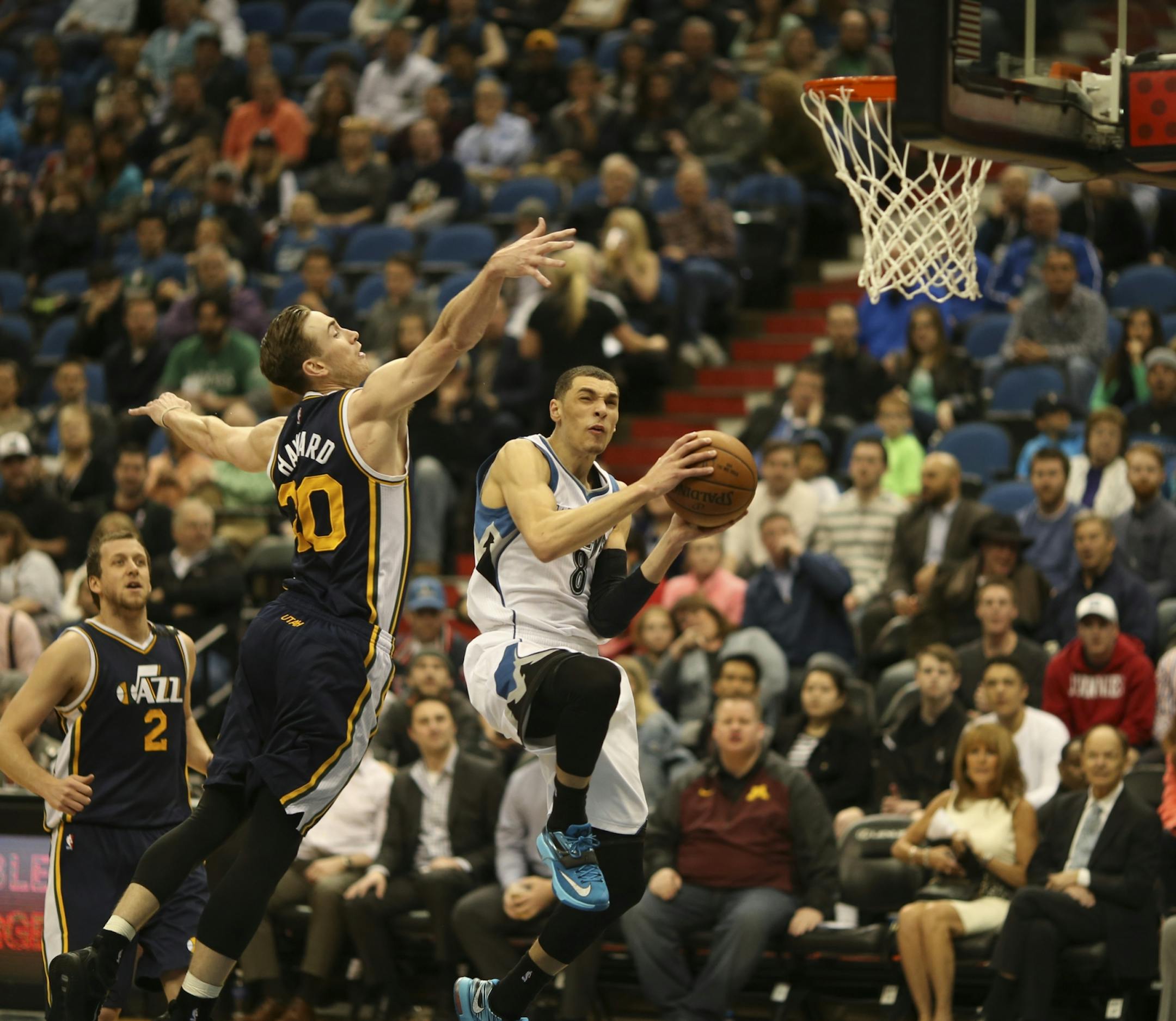 Timberwolves guard Zach LaVine slid under the defense of Utah Jazz forward Gordon Hayward on his way to a dunk in the third quarter Monday night at Target Center. LaVine led the Wolves in scoring with 21 points for the night.