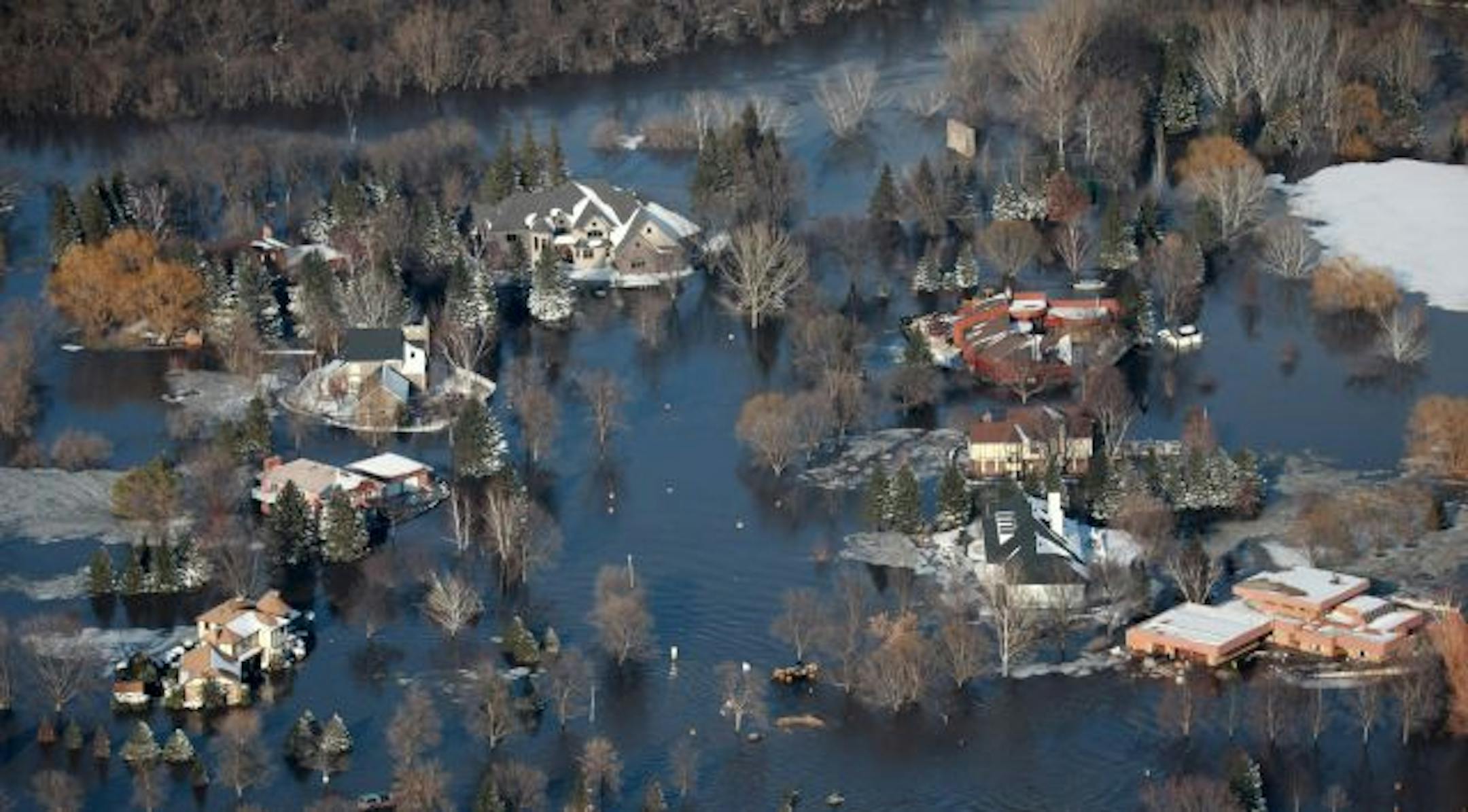 The Briarwood neighborhood of Fargo, N.D. is seen, Friday, March 27, 2009. Thousands of shivering, tired residents got out while they could and others prayed that miles of sandbagged levees would hold Friday as the surging Red River threatened.