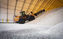 Crews moved salt in a storage shelter to make room for an upcoming delivery at a MnDOT station in Maple Grove on Tuesday. A mild, nearly-snowless wint