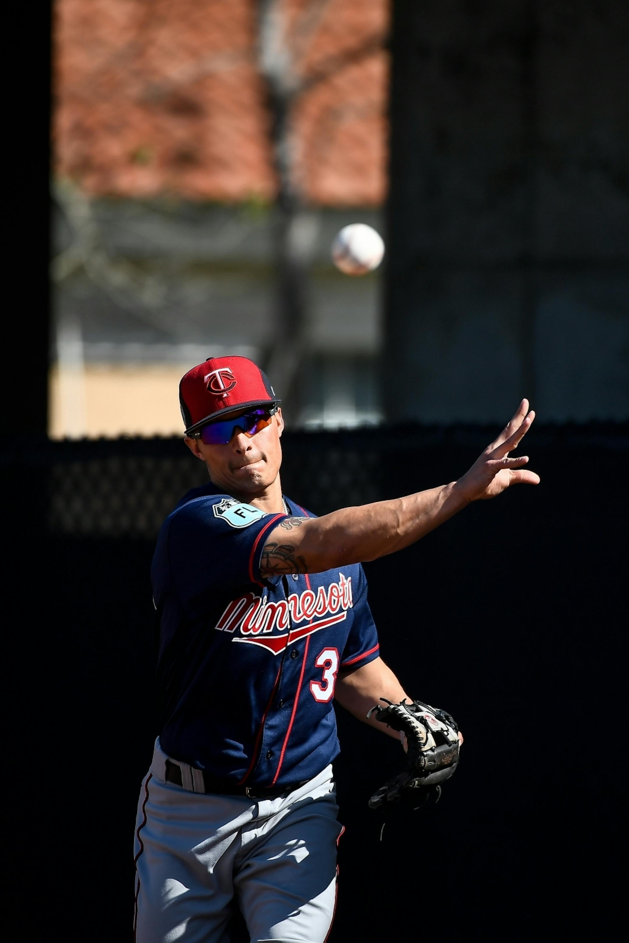 Minnesota Twins infielder Tommy Field (30) threw the ball to first during practice Sunday.