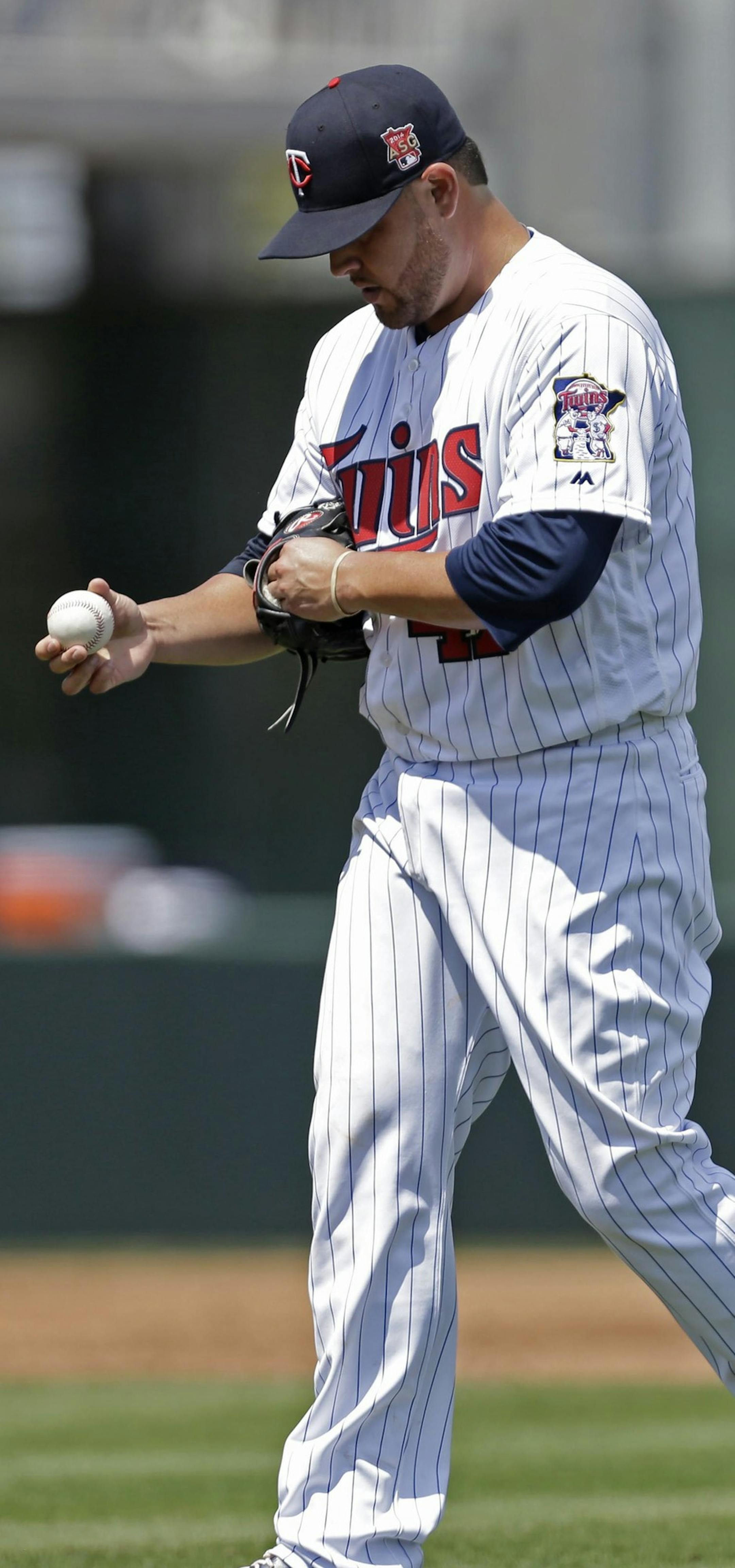 Minnesota Twins starting pitcher Ricky Nolasco (47) reacts during the first inning of an exhibition baseball game against the New York Mets in Fort Myers, Fla., Friday, March 21, 2014. (AP Photo/Gerald Herbert)