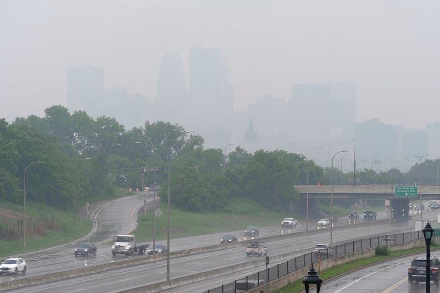 Smoke from wildfires burning in Canada and rain obscures the downtown skyline of Minneapolis on June 3.