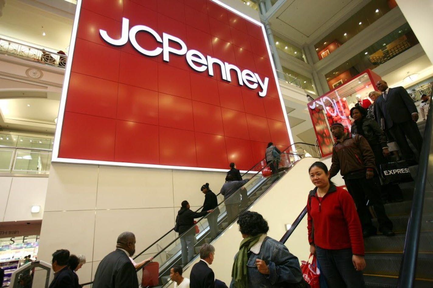 In this Friday, Oct. 23, 2009 photo, shoppers visit a J.C. Penney store in New York.