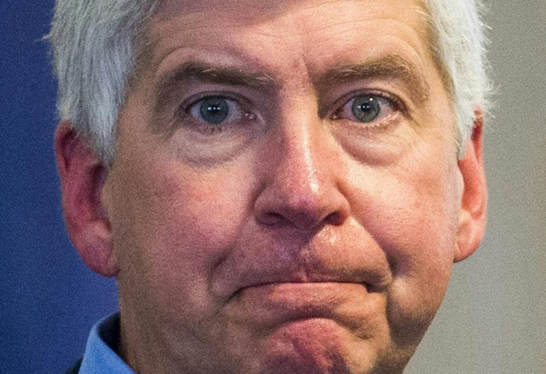 FILE - In a Monday, Jan. 11, 2016 file photo, Michigan Gov. Rick Snyder speaks during a news conference in Flint, Mich. the fallout from a water crisis in another impoverished city have marred the Republican's image as a practical problem-solver.Snyder is preparing to deliver his sixth State of the State address Tuesday, Jan. 19, where he will be met by a large protest that is likely to echo the withering criticism over Flint's water disaster coming from inside and outside of Michigan. (Jake May
