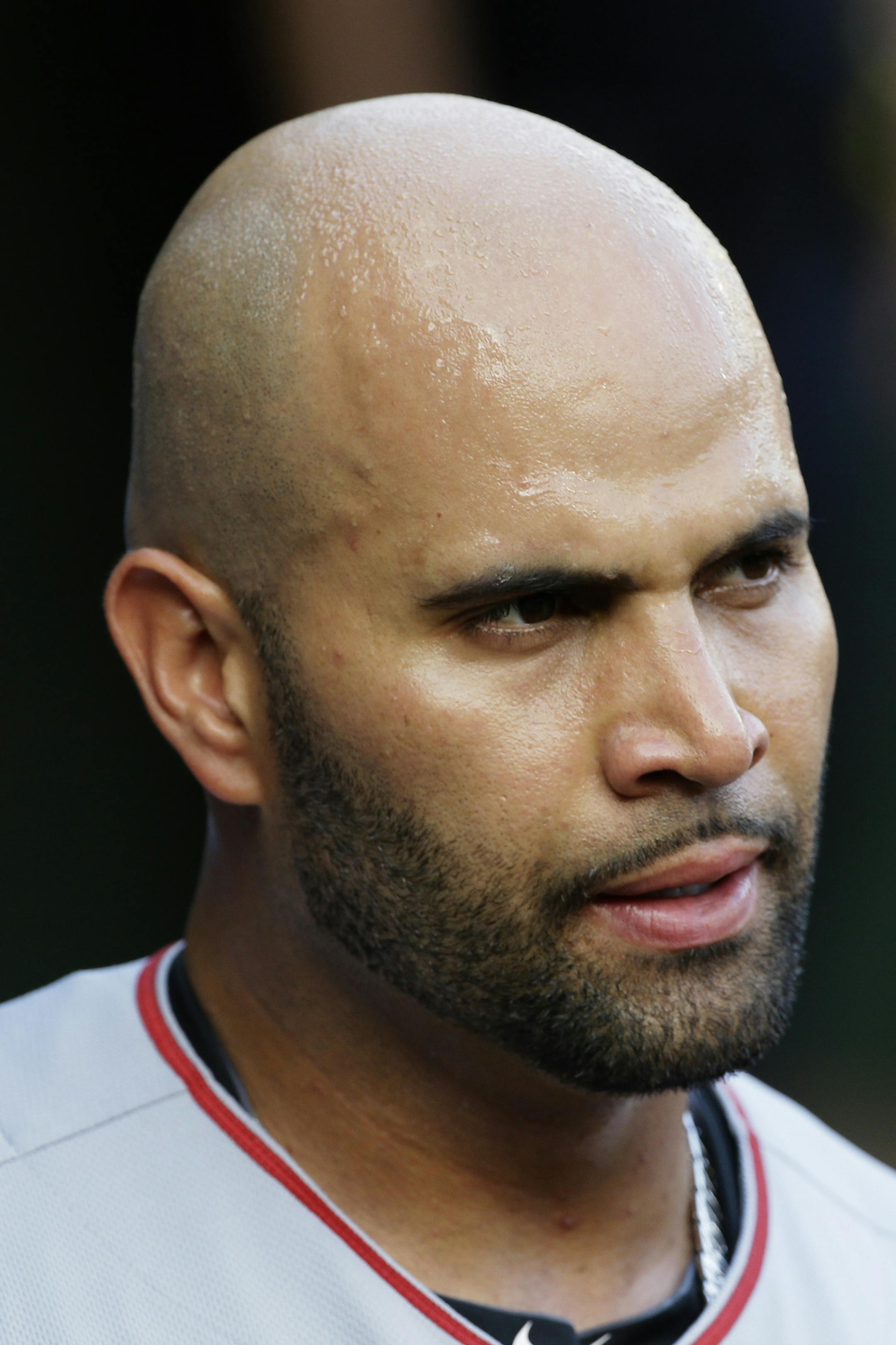 Los Angeles Angels Albert Pujols walks in the dugout during a baseball game against the Texas Rangers in Arlington, Texas, Sunday, July 5, 2015. (AP Photo/LM Otero)