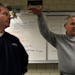 Aviation instructor Peter Pitman (right), and the White Bear Lake High School started an aviation class in memory of the son of John Marzitelli (left)