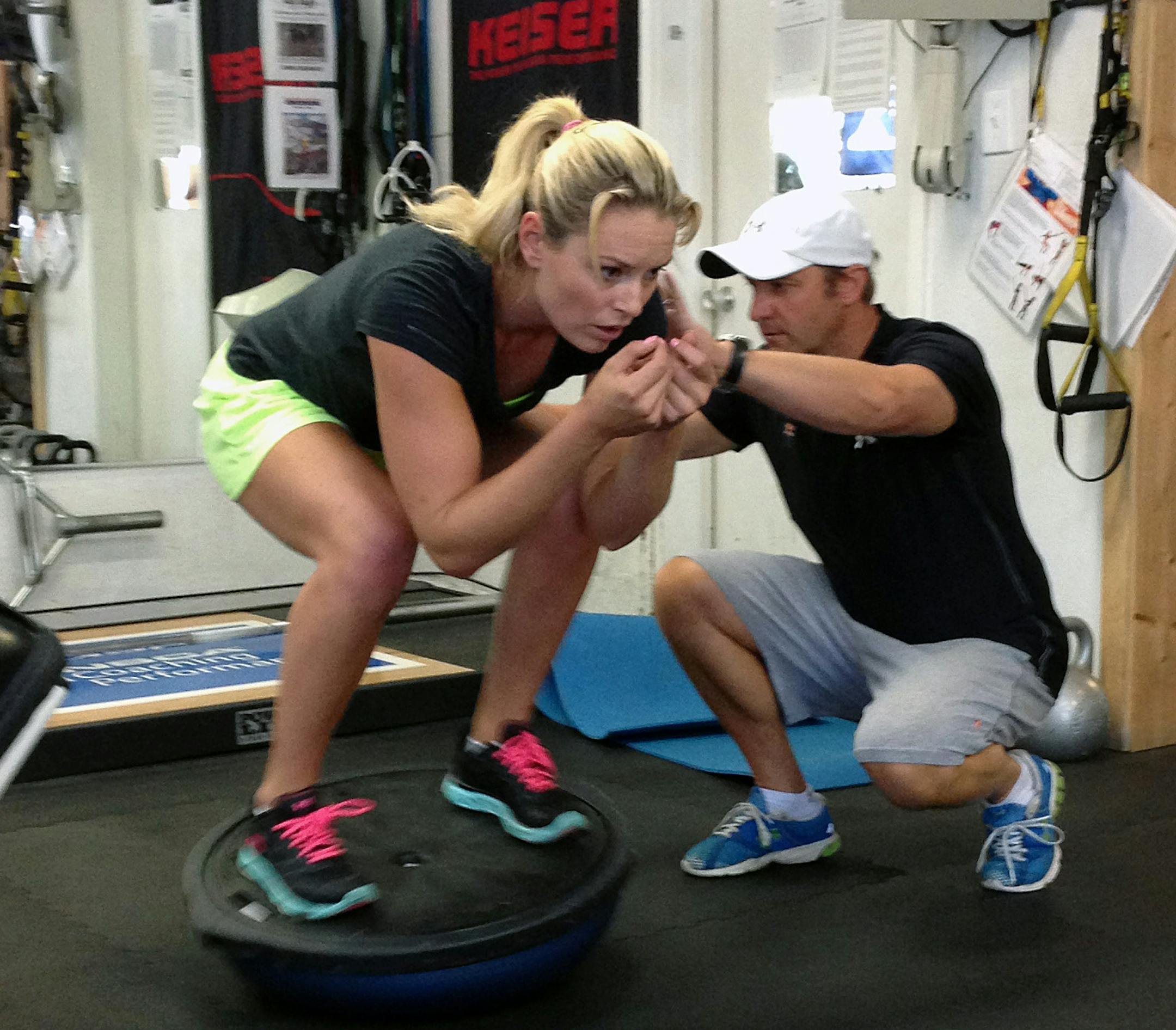 Lindsey Vonn works out with Red Bull coach Martin Hager in Vail, Colo., Wednesday Aug. 28, 2013. Vonn's surgically repaired right knee is nearly fully healed and she plans to ski this weekend. The four-time overall World Cup champion is looking at a possible return to competition in late November in Beaver Creek, Colo. That's three months ahead of the Sochi Olympics, where she will defend her downhill title. (AP Photo/Pat Graham) ORG XMIT: MIN2013082815271417