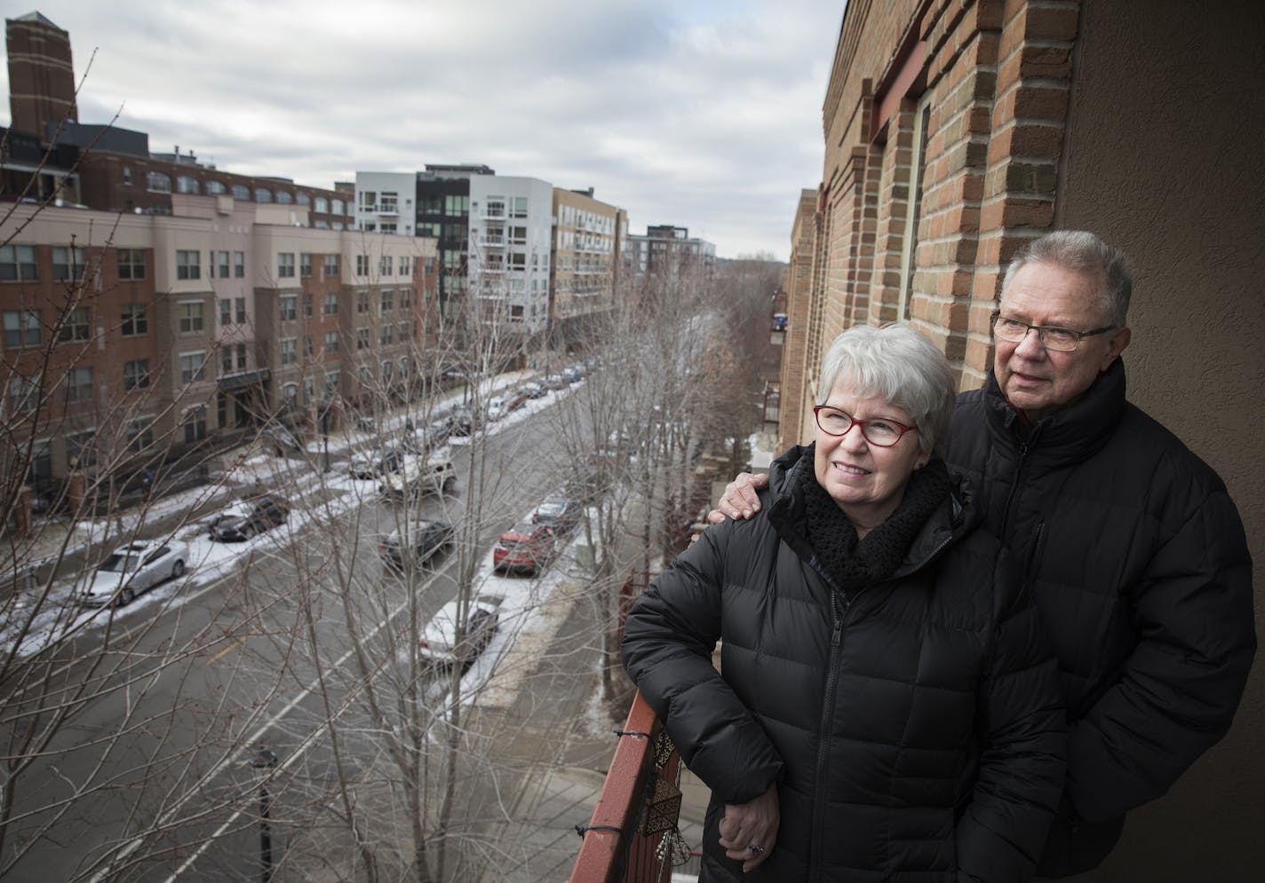 Jan and Art Larson on the balcony of their downtown Minneapolis condo.