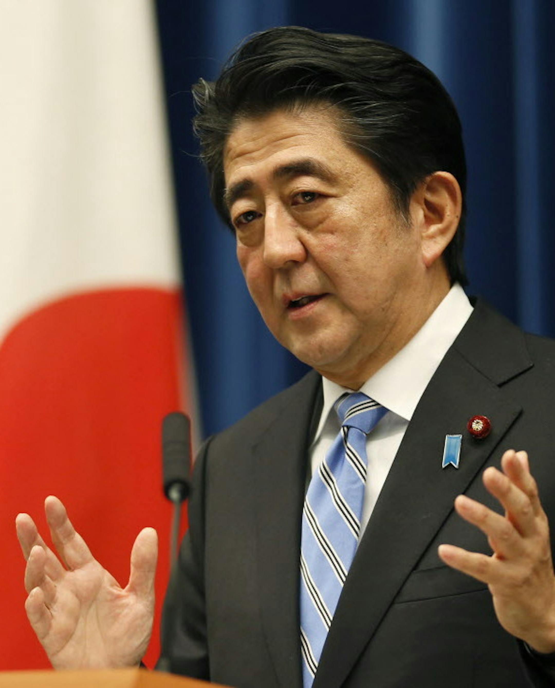 Japan's Prime Minister Shinzo Abe speaks during a press conference at his official residence in Tokyo, Tuesday, Nov. 18, 2014. Abe called a snap election for December and put off a sales tax hike planned for next year until 2017, vowing to step down if his strategy falls flat. (AP Photo/Shizuo Kambayashi)