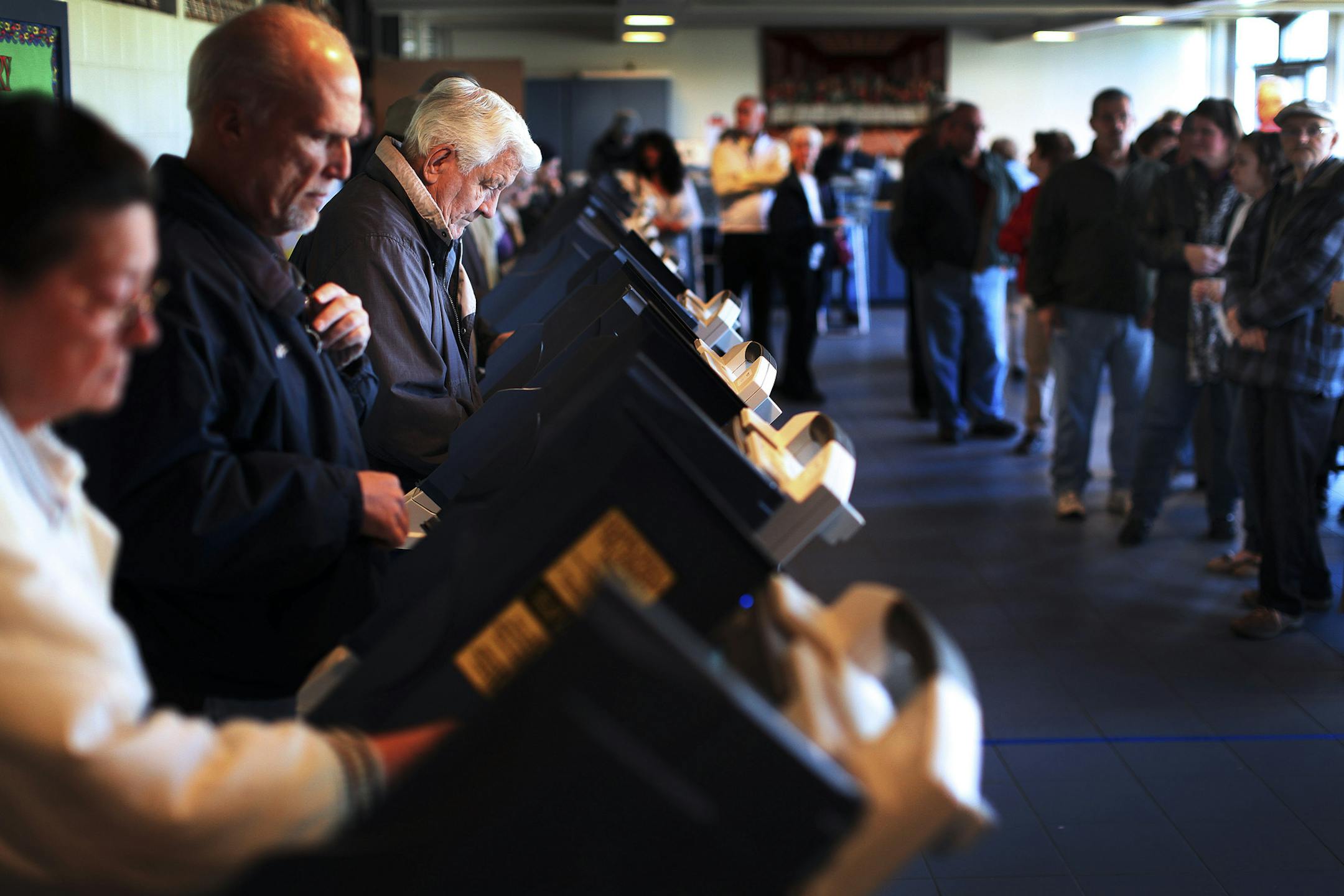 FILE-- Voters cast ballots at a polling station in Reedurban Presbyterian Church in Canton, Ohio, on Election Day Nov. 6, 2012. Low turnout early in the day among demographic groups likelier to vote for President Obama made his campaign team think he was going to lose the state (he didn’t). In a first, results will be estimated before the polls close in 2016. It’s hard for even pros to do, and very easy for readers to get the wrong impression. (Michael F. McElroy/The New York Times