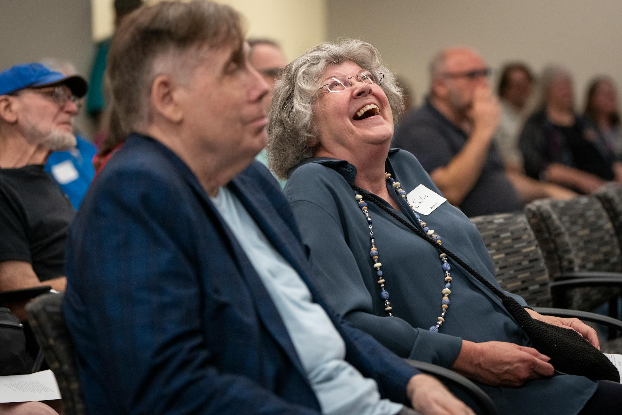 Emilie Quast, a former colleague of Tretter's, laughed during the joyous celebration of life for Jean-Nickolaus Tretter.