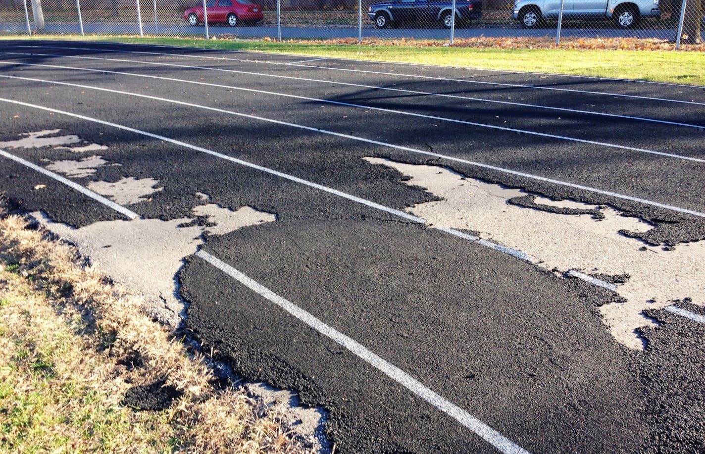 A thin layer that cushions the track at South High School in Minneapolis is peeling and years overdue for resurfacing,