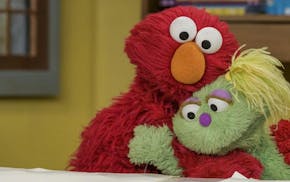 Elmo and Karli on "Sesame Street." In May, the show's creators introduced Karli, a Muppet in foster care, and in October they revealed the reason for