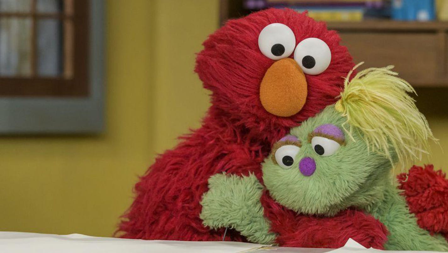 Elmo and Karli on "Sesame Street." In May, the show's creators introduced Karli, a Muppet in foster care, and in October they revealed the reason for her situation: Her mom struggles with substance abuse. (Sesame Workshop/PBS/TNS) ORG XMIT: 1464183