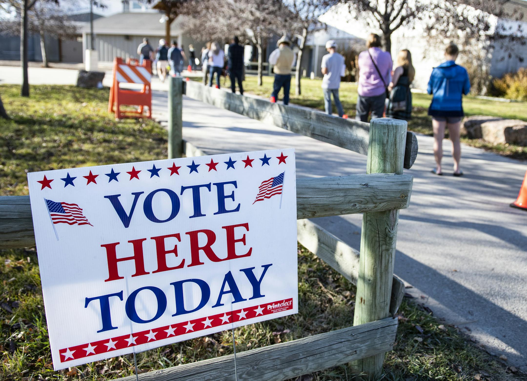 Patrons of the Gallatin County Fairgrounds wait in line to cast their ballots in Bozeman, Mont., on Tuesday, Nov. 3.