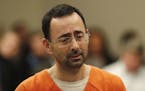 Dr. Larry Nassar appears in court for a plea hearing in Lansing, Mich., Wednesday, Nov. 22, 2017.
