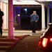 Saint Paul Police spoke on the phone outside of the Bradshaw Funeral Home Saturday night after a man was shot by St. Paul Police earlier.