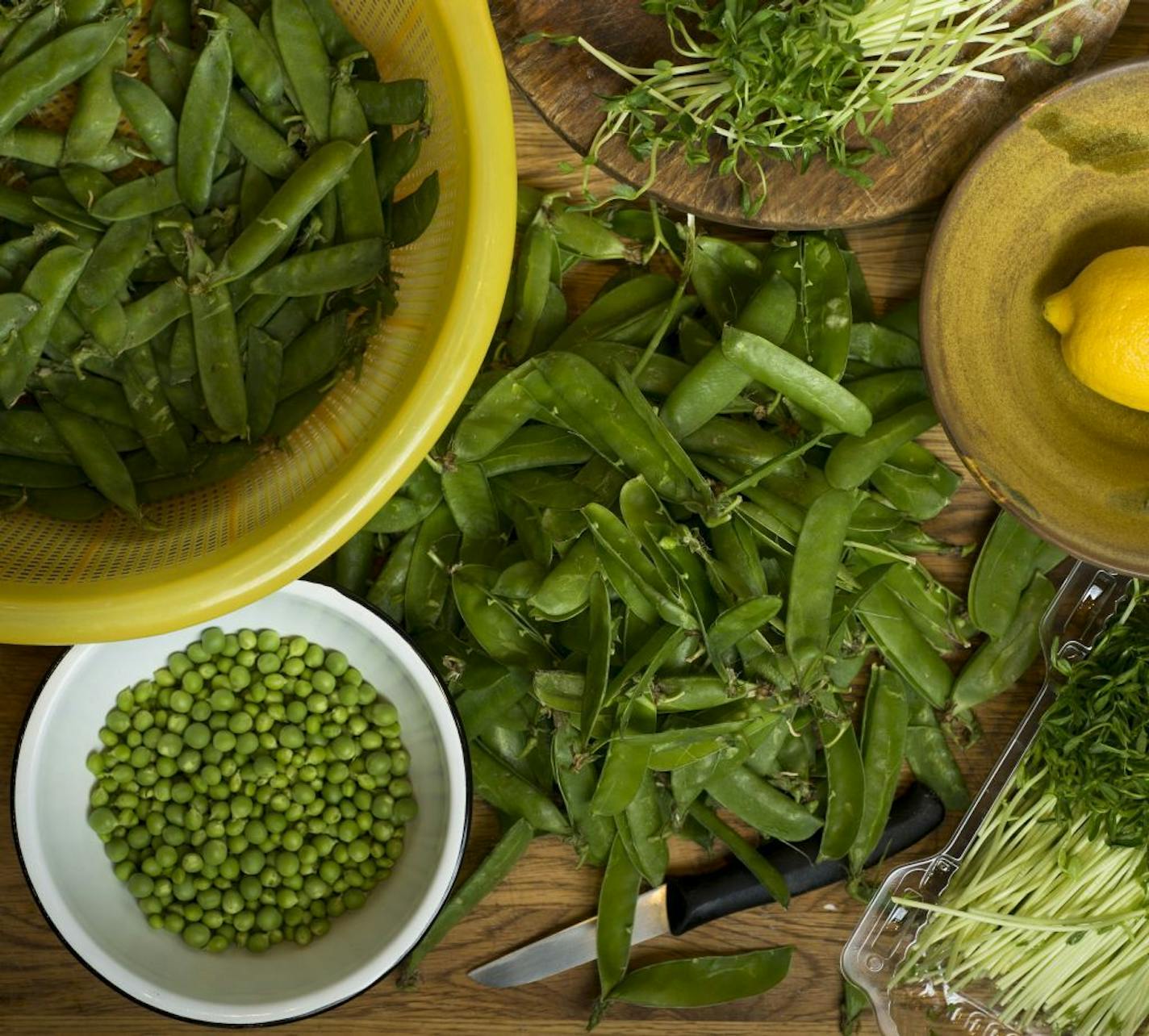 Peas, in a variety of stages from pea shoots to discarded shells, in New York, April 15, 2014. Most peas are eaten straight from cold storage, but when given the chance to taste sweet fresh green peas, there's a noticeable difference.