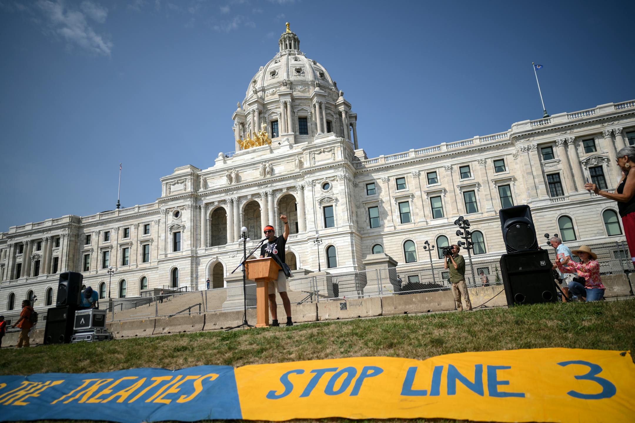 Wakaja Hari, 'Distant Thunder,' who also goes by Robert Pilot, raised his fist to the air and chanted 'Stop Line 3' as he led off a slate of speakers at Wednesday's protest.