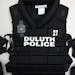 A chest protector, elbow and forearm protector sat out to display new pieces of Duluth police riot gear. The chest protector includes numbers for iden