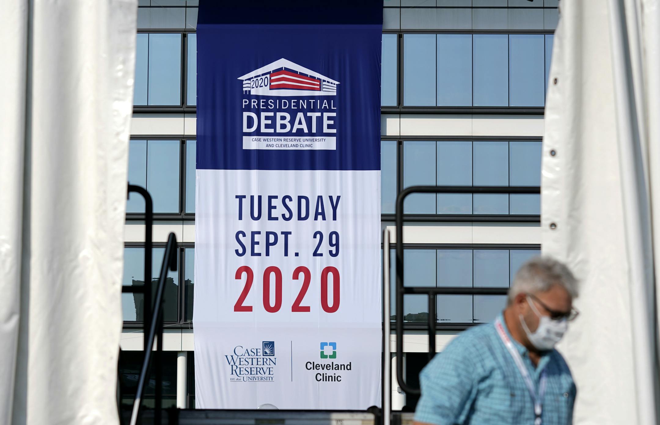 Preparations take place for the first Presidential debate outside the Sheila and Eric Samson Pavilion, Sunday, Sept. 27, 2020, in Cleveland. The first debate between President Donald Trump and Democratic presidential candidate, former Vice President Joe Biden is scheduled to take place Tuesday, Sept. 29. (AP Photo/Patrick Semansky)