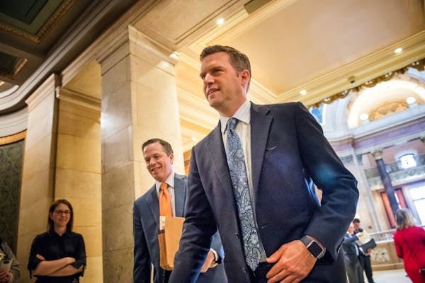 Ben Golnik, Executive Director, Majority Caucus, walked into the House Chamber with his boss Kurt Daudt, to start the day's session.