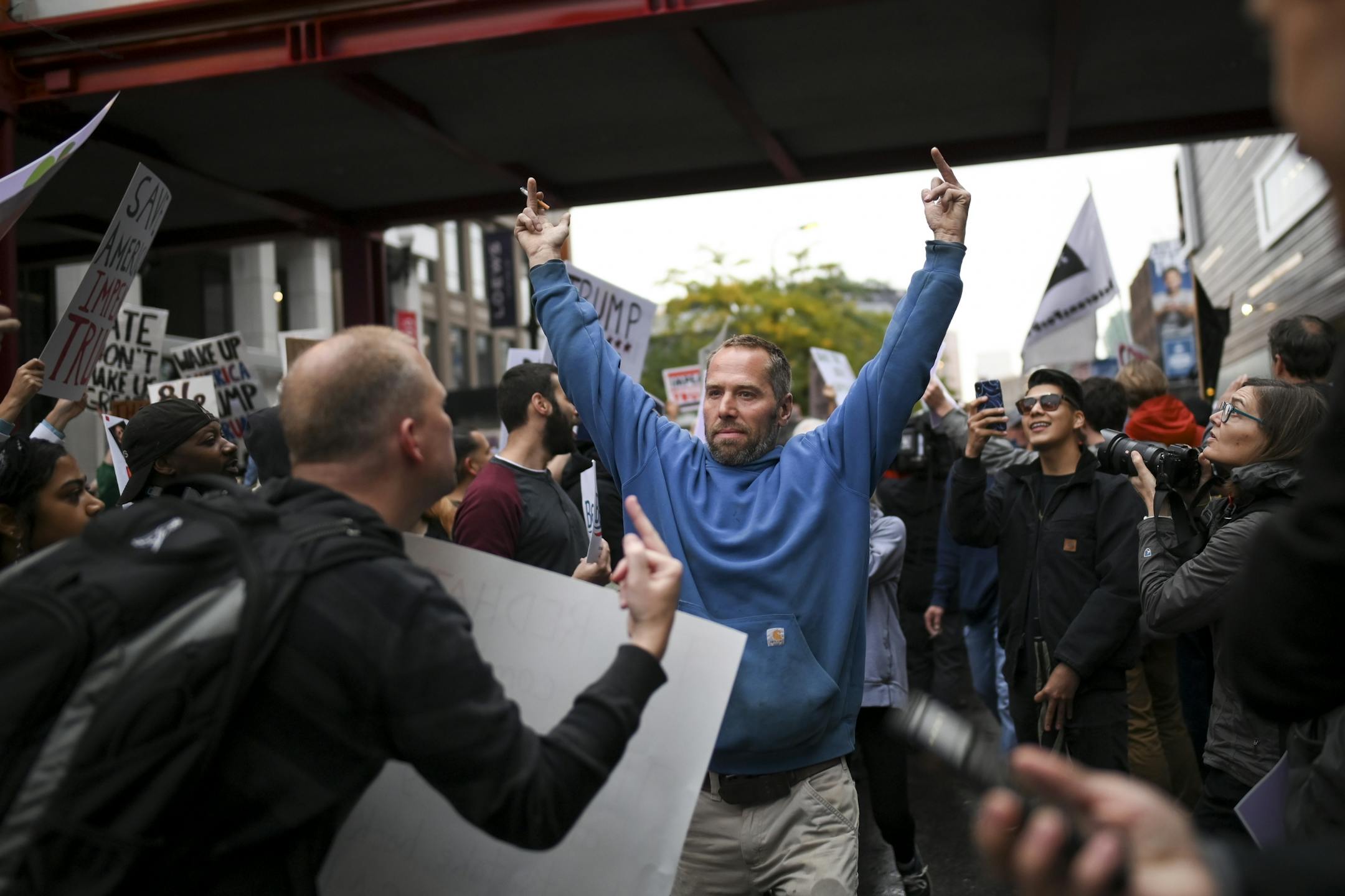 Trump supporters and protesters exchanged taunts outside Target Center Thursday night.