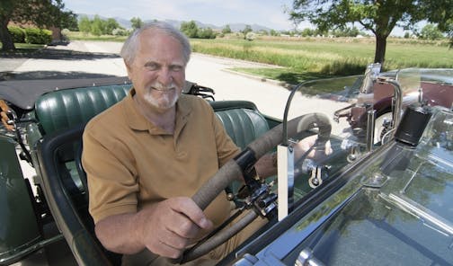 This 2007 image released by G.P. Putnam's Sons shows author Clive Cussler riding in a classic car. Cussler died on Monday, Feb. 24, 2020 at his home in Scottsdale, AZ. He was 88. (Ronnie Bramhall/G.P. Putnam's Sons via AP)