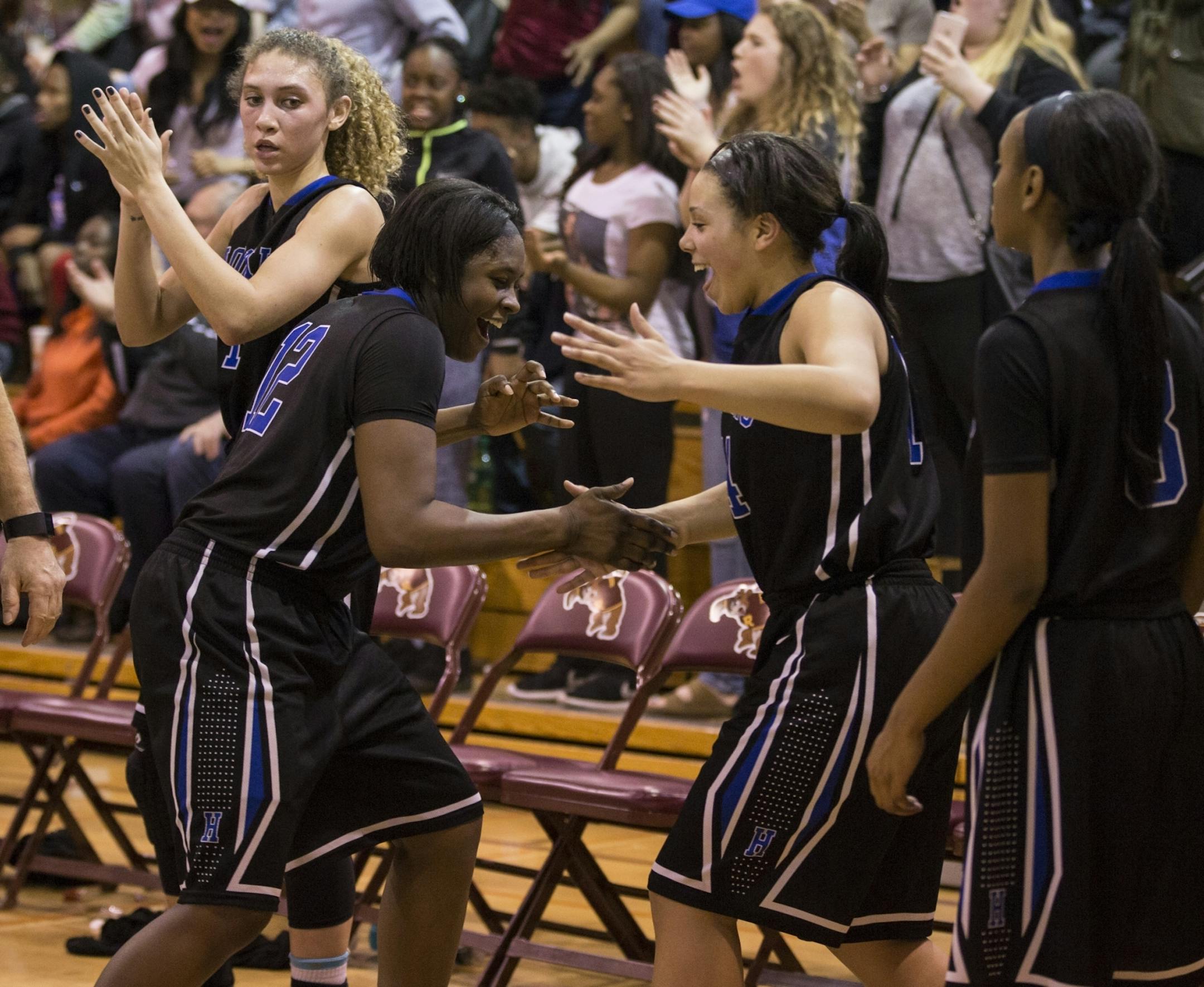 Hopkins players Nia Hollie, left and Ashley Bates celebrated the Royals' 88-62 victory over Wayzata in the Class 4A, Section 6 championship on March 8 at Minneapolis Roosevelt High School.