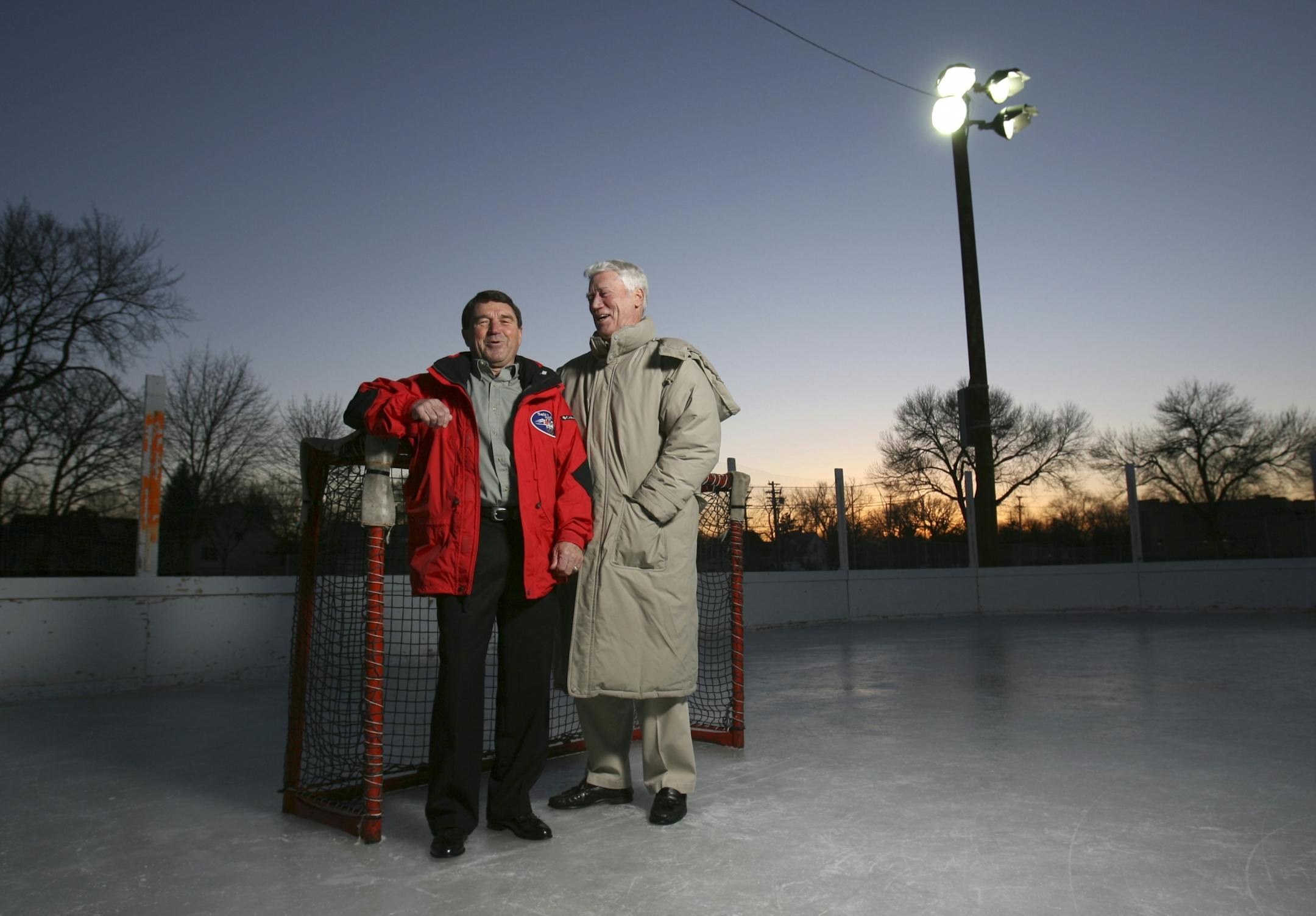 Dick Meredith and Wendell Anderson cracked each other up as they posed for a portrait at the hockey rink at Brackett Park in Minneapolis at dusk Wednesday evening. GENERAL INFORMATION: JEFF WHEELER � jwheeler@startribune.com MINNEAPOLIS - 1/25/06 - Dick Meredith and former Gov. Wendell Anderson were two of eleven Minnesotans on the silver medal-winning U.S. Olympic hockey team of 50 years ago.