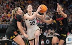 Iowa Hawkeyes guard Caitlin Clark (22) drove to the hoop against Maryland at Target Center during last year's Big Ten women's tournament.