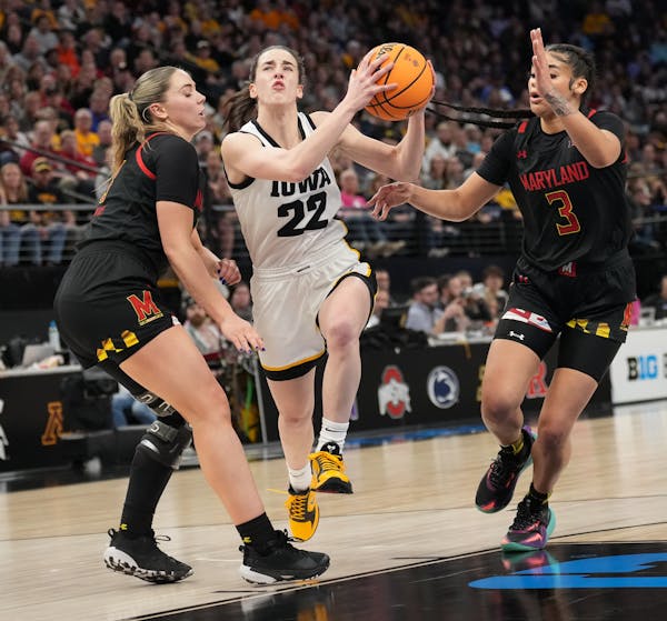 Iowa Hawkeyes guard Caitlin Clark (22) drove to the hoop against Maryland at Target Center during last year's Big Ten women's tournament.