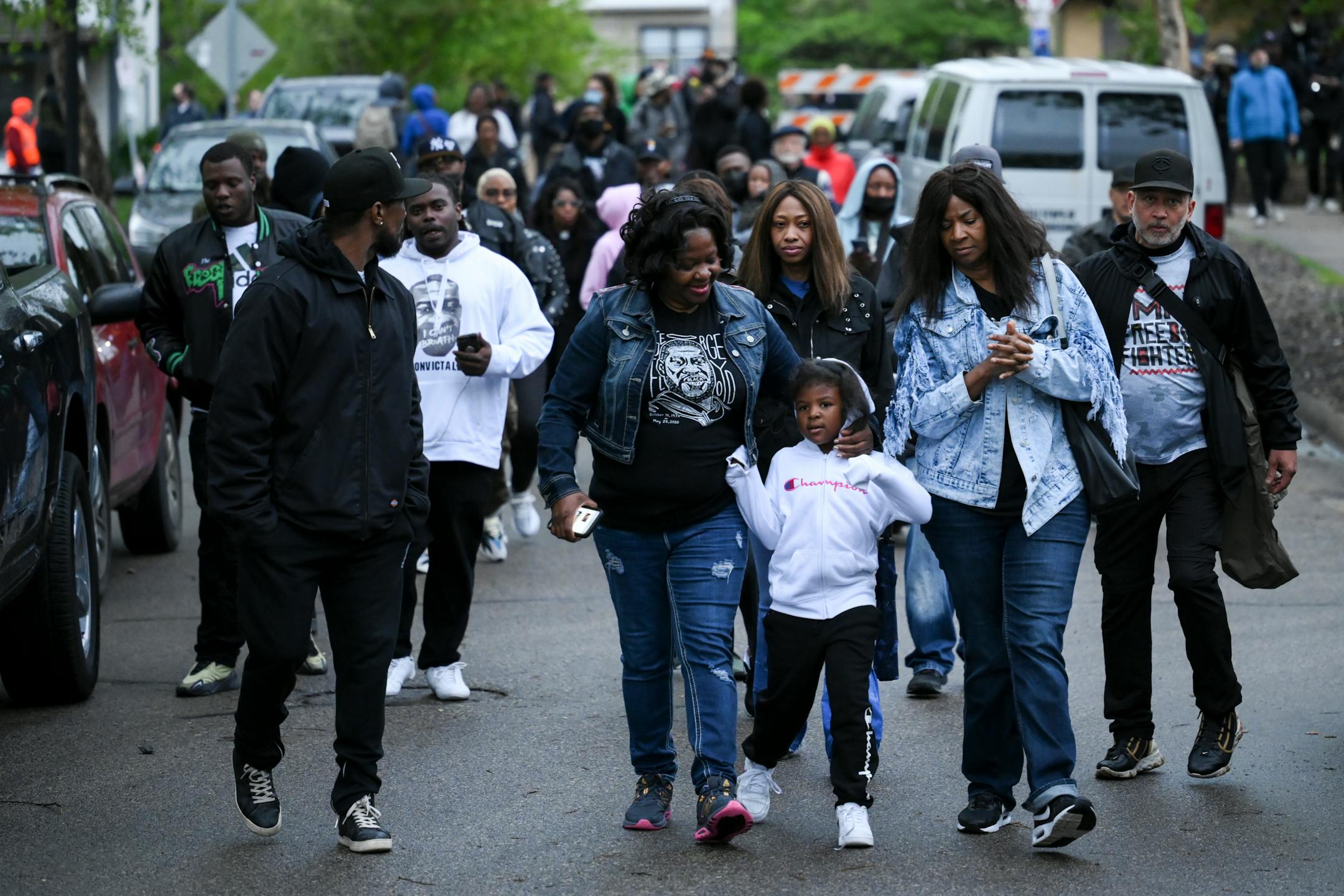 George Floyd's family members march to the 'Say Their Names Cemetery' before a vigil.