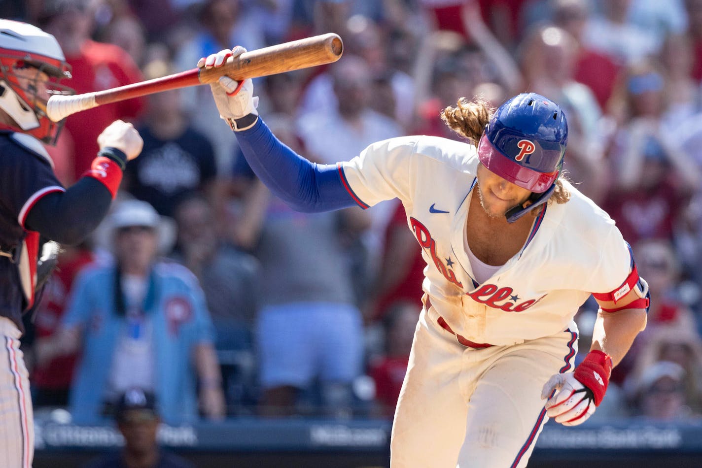 Philadelphia Phillies' Alec Bohm throws his bat after striking out with the bases loaded during the seventh inning of a baseball game against the Minnesota Twins, Sunday, Aug. 13, 2023, in Philadelphia. (AP Photo/Laurence Kesterson)