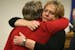 Claudia Jones, left, and Barbara Brown, the mother and step-mother of Margorie Ann Holland, hugged after a press conference, Tuesday, December 17, 201