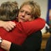 Claudia Jones, left, and Barbara Brown, the mother and step-mother of Margorie Ann Holland, hugged after a press conference, Tuesday, December 17, 201
