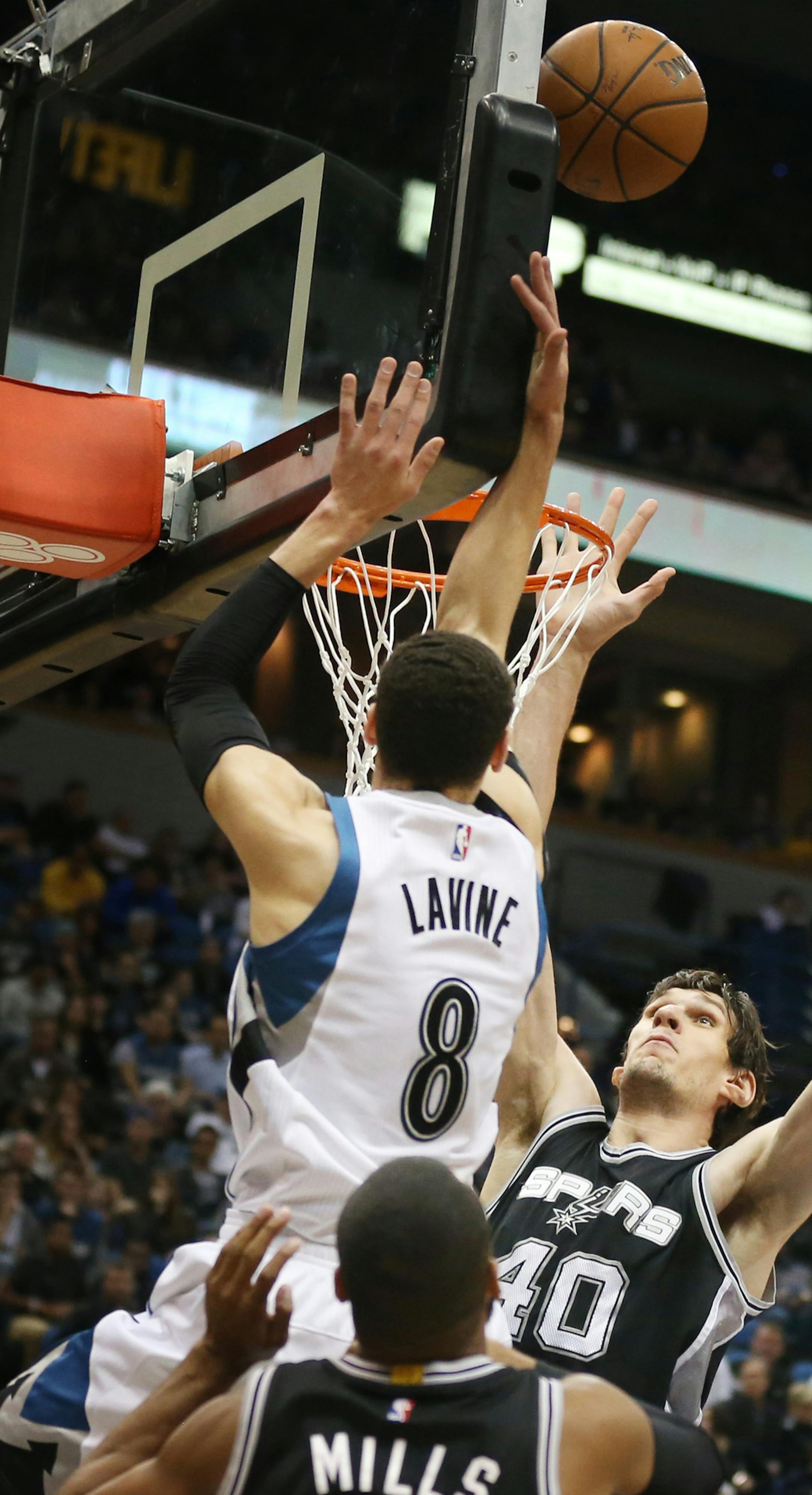 Minnesota Timberwolves guard Zach LaVine (8) scored on Spurs defenders at Target Center Tuesday March 8, 2016 in Minneapolis , MN. ] The Minnesota Timberwolves hosted the San Antonio Spurs. Jerry Holt/Jerry.Holt@Startribune.com