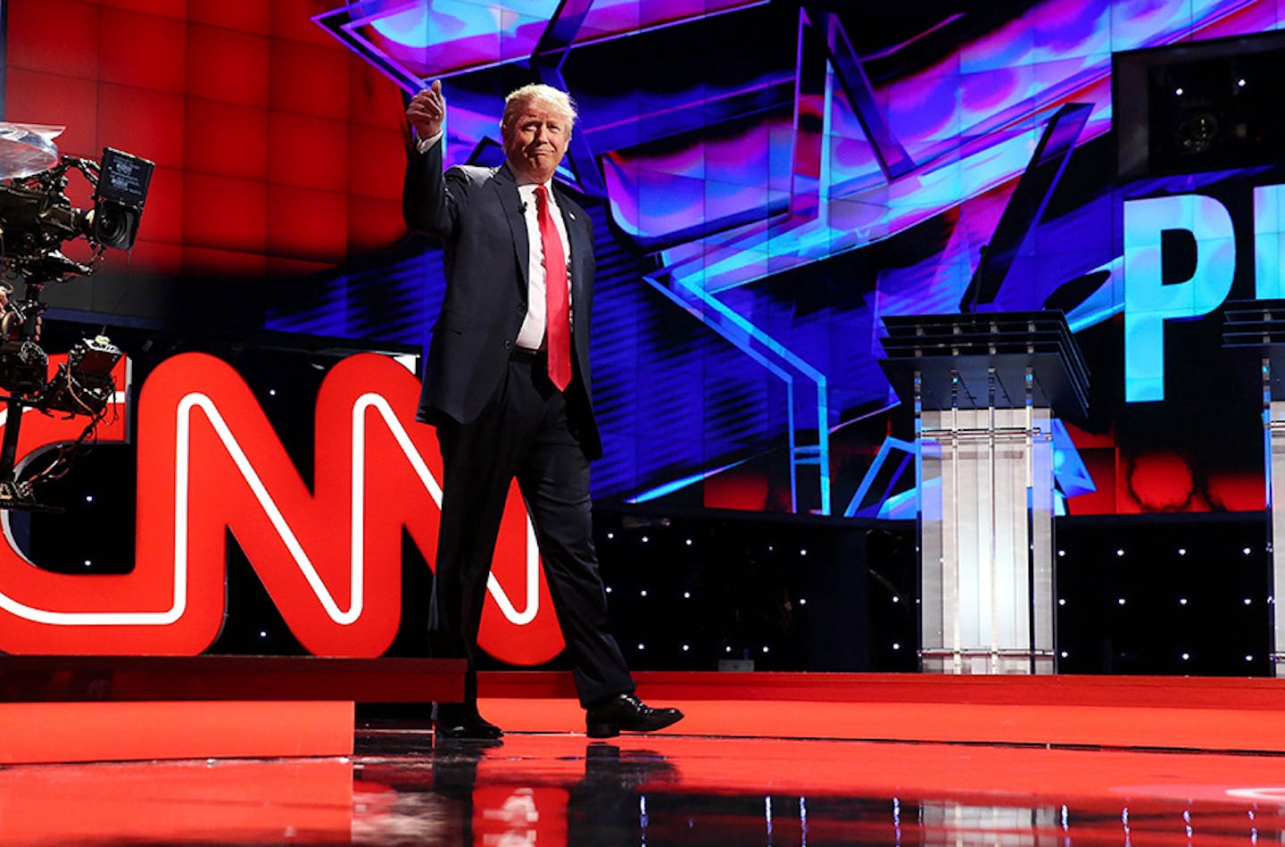 Donald Trump takes the stage before the debate of Republican presidential hopefuls at the Venetian in Las Vegas, Dec. 15, 2015.