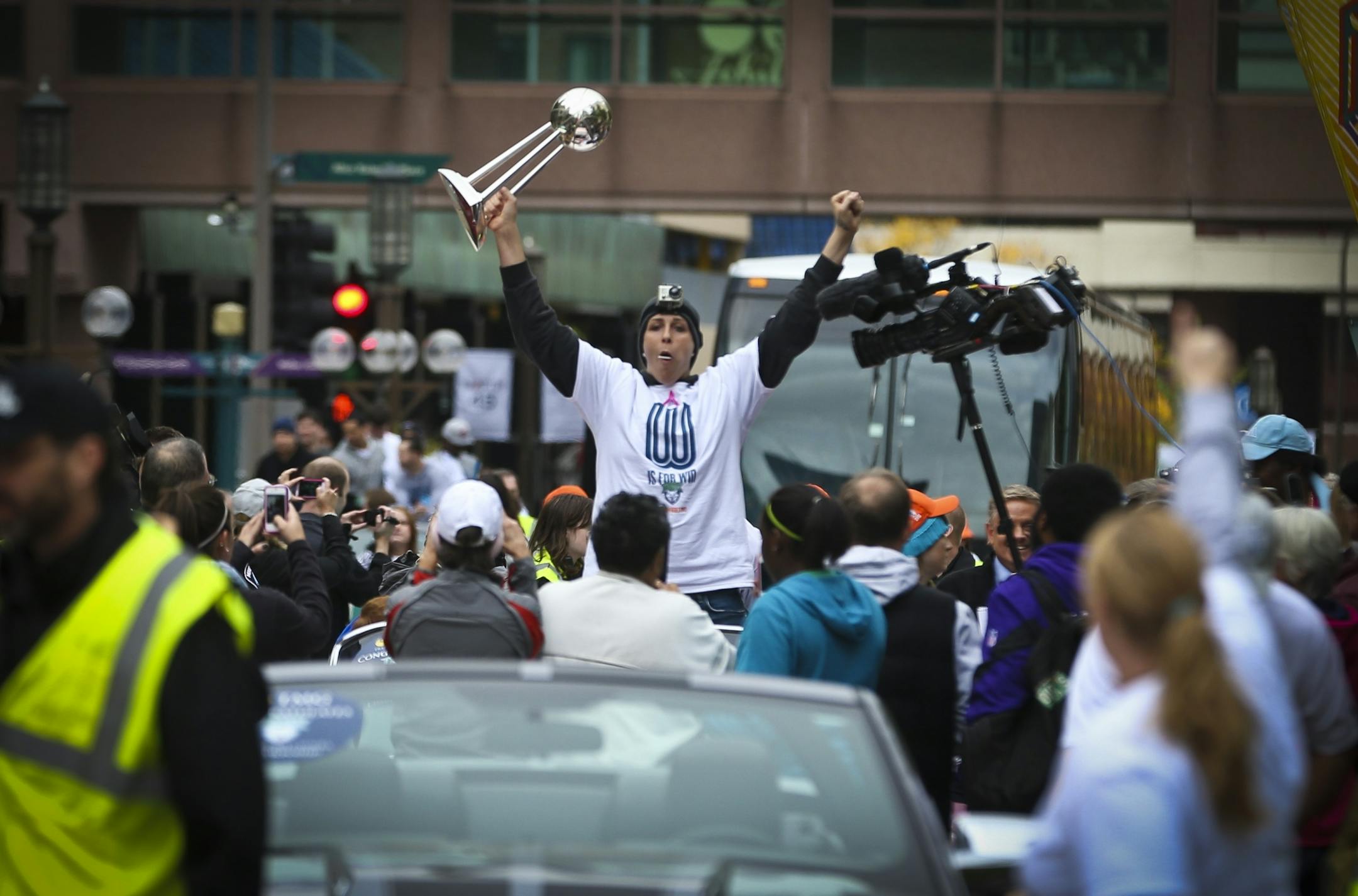 Janel McCarville of the Minnesota Lynx held up the trophy at the start of the championship celebration parade for the WNBA champions on Monday, October 14, 2013, through downtown Minneapolis, Minn.