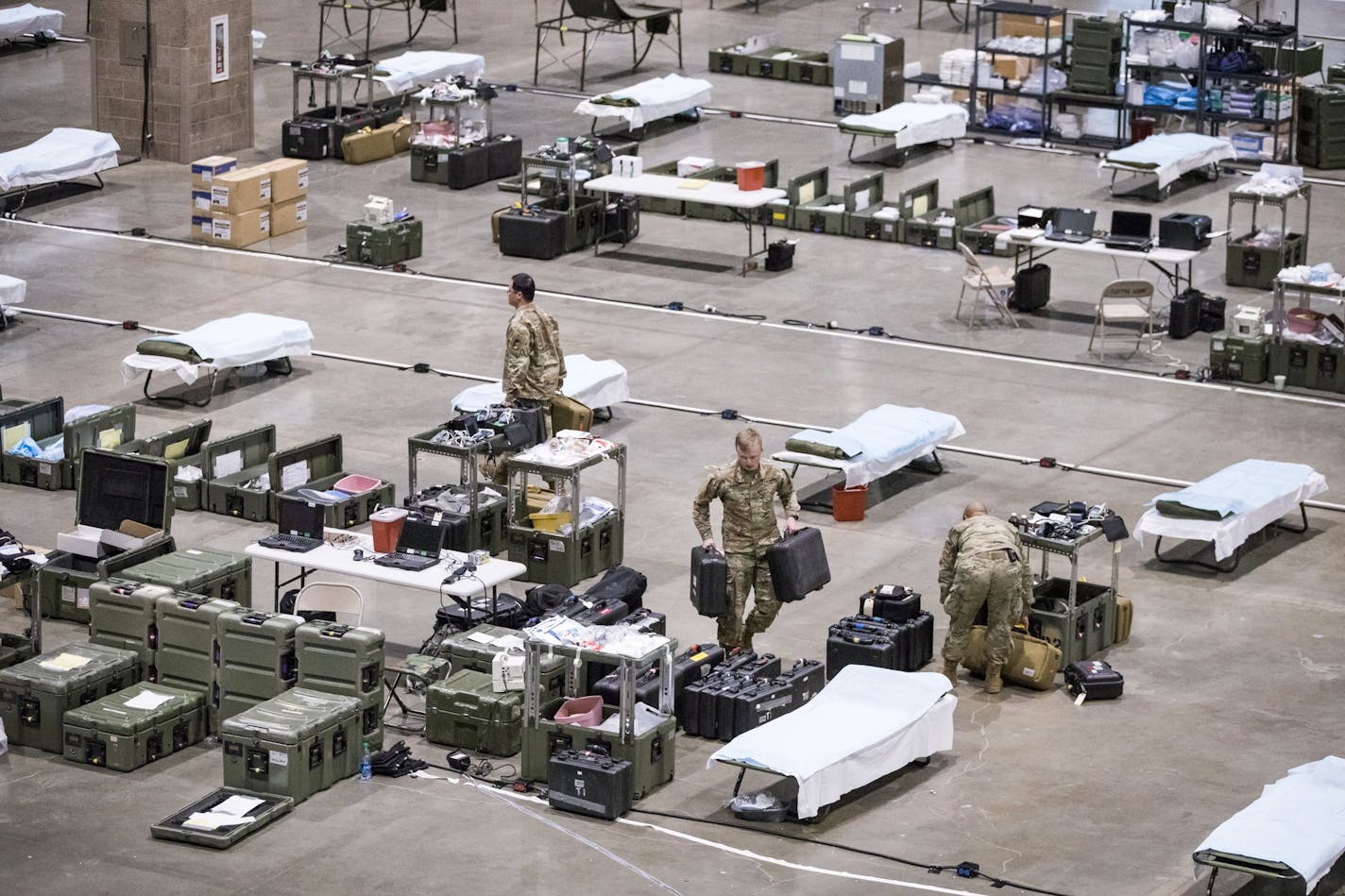 Army soldiers from Fort Carson and Fort Lewis are setting up a field hospital for non-COVID-19 patients at CenturyLink Field Events Center in Seattle. (Amanda Snyder/Seattle Times/TNS)