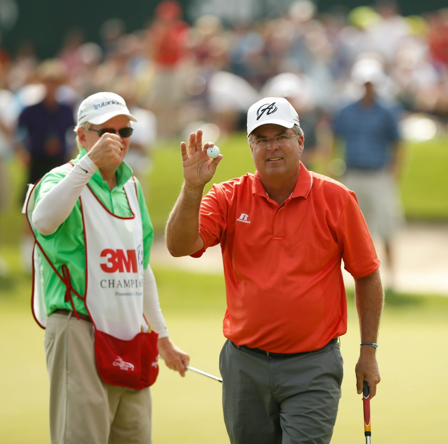 Kenny Perry held up his ball after he sunk a 15 foot putt on the 18th hole for a birdie and the tournament win Sunday afternoon at the TPC in Blaine. ] JEFF WHEELER • jeff.wheeler@startribune.com The 3M Championship concluded on Sunday afternoon with Kenny Perry winning by a stroke over a Bernhard Langer at the Tournament Players Club Twin Cities in Blaine August 3, 2014.