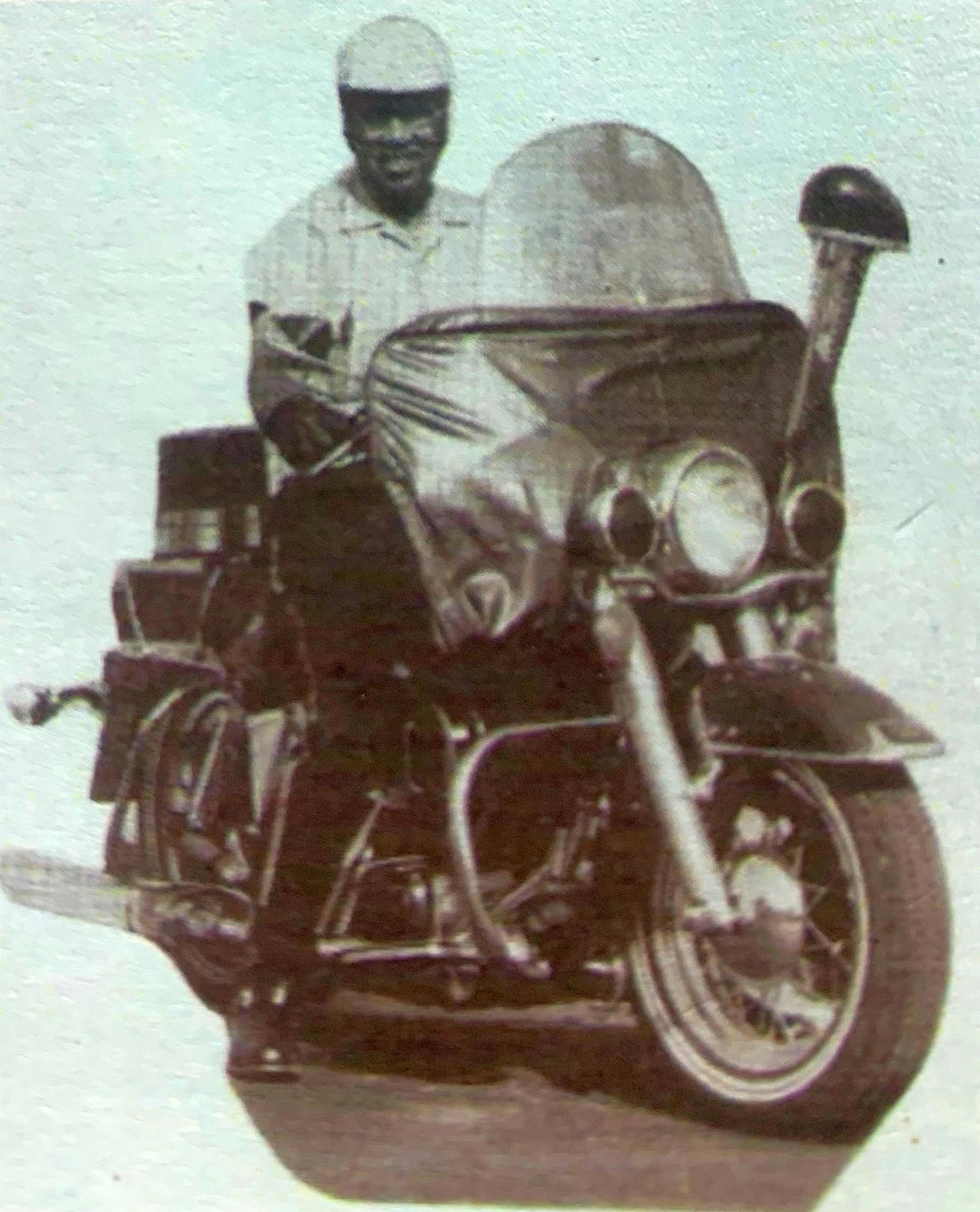 Fletcher Lee Cornely Sr. at the helm of a motorcycled used in his funeral escort business.