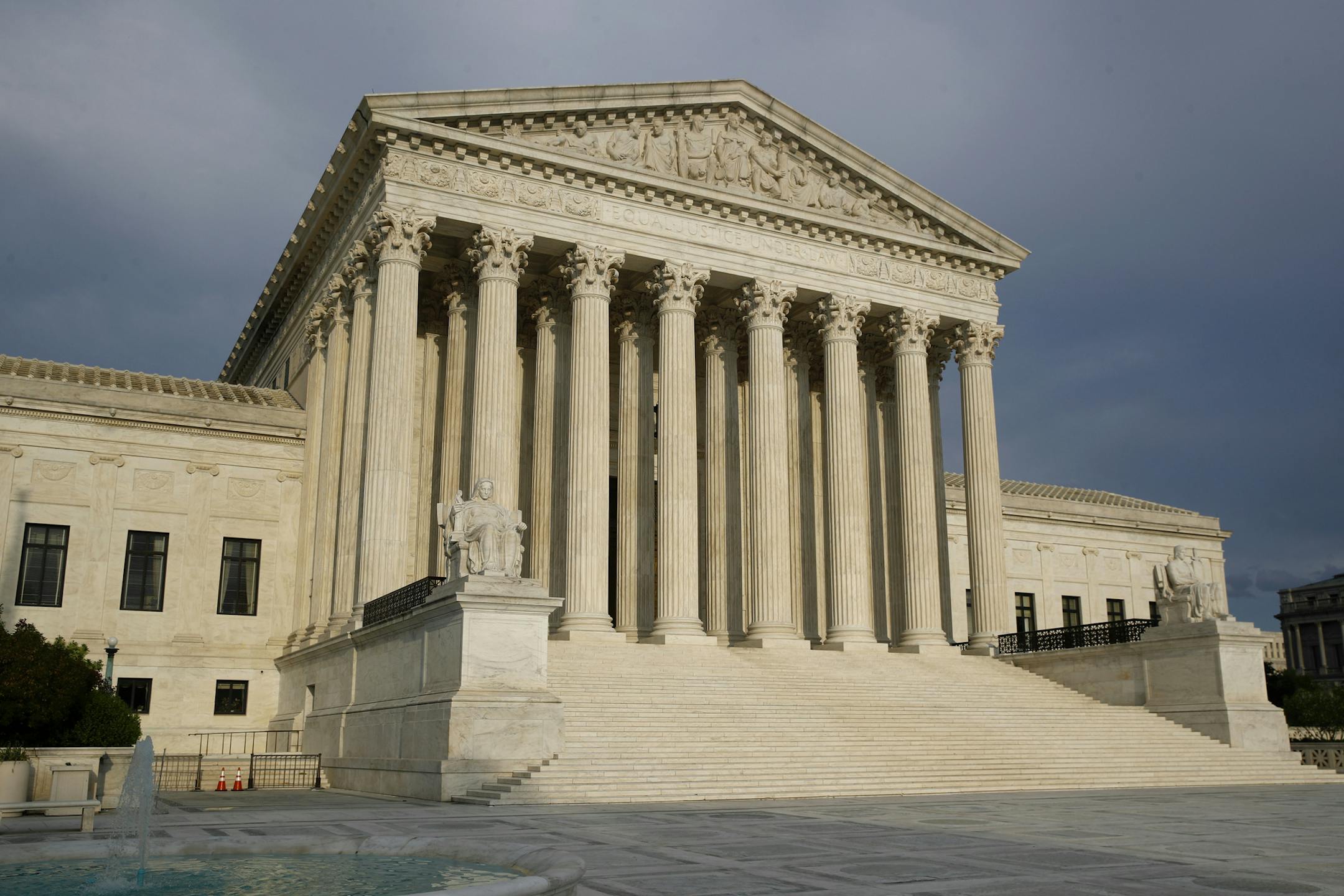 FILE - In this May 3, 2020, file photo the setting sun shines on the Supreme Court building on Capitol Hill in Washington. The Supreme Court opens a new term Monday, Oct. 5. (AP Photo/Patrick Semansky, File)