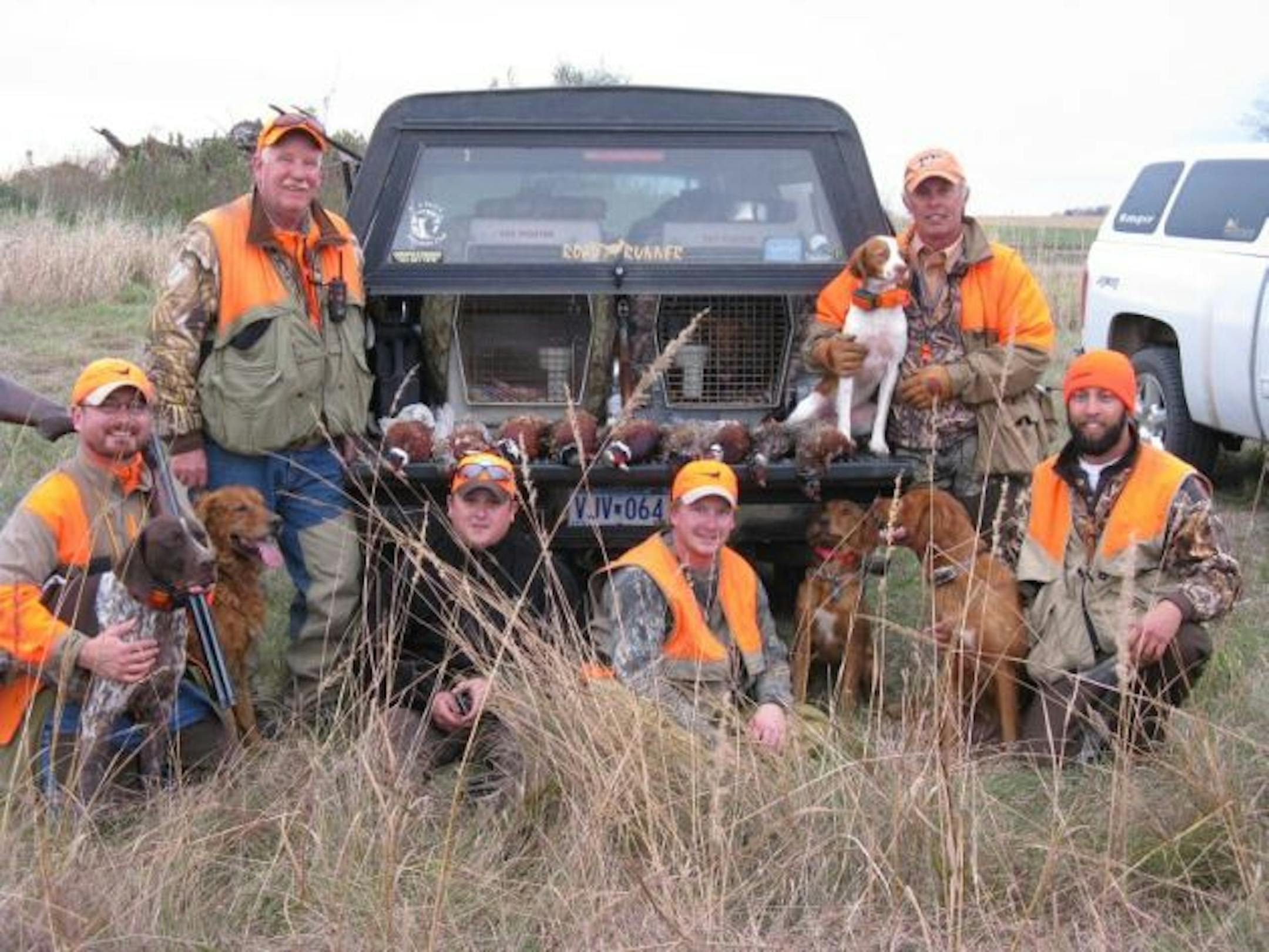 (left to right) Bob St.Pierre, Steve Kuyper, Brian Zustiak, John Kuyper, Billy Hildebrand, Erik Hildebrand and Matt Kucharski (operating the camera) with 9 roosters before hunting the day's final walk.
