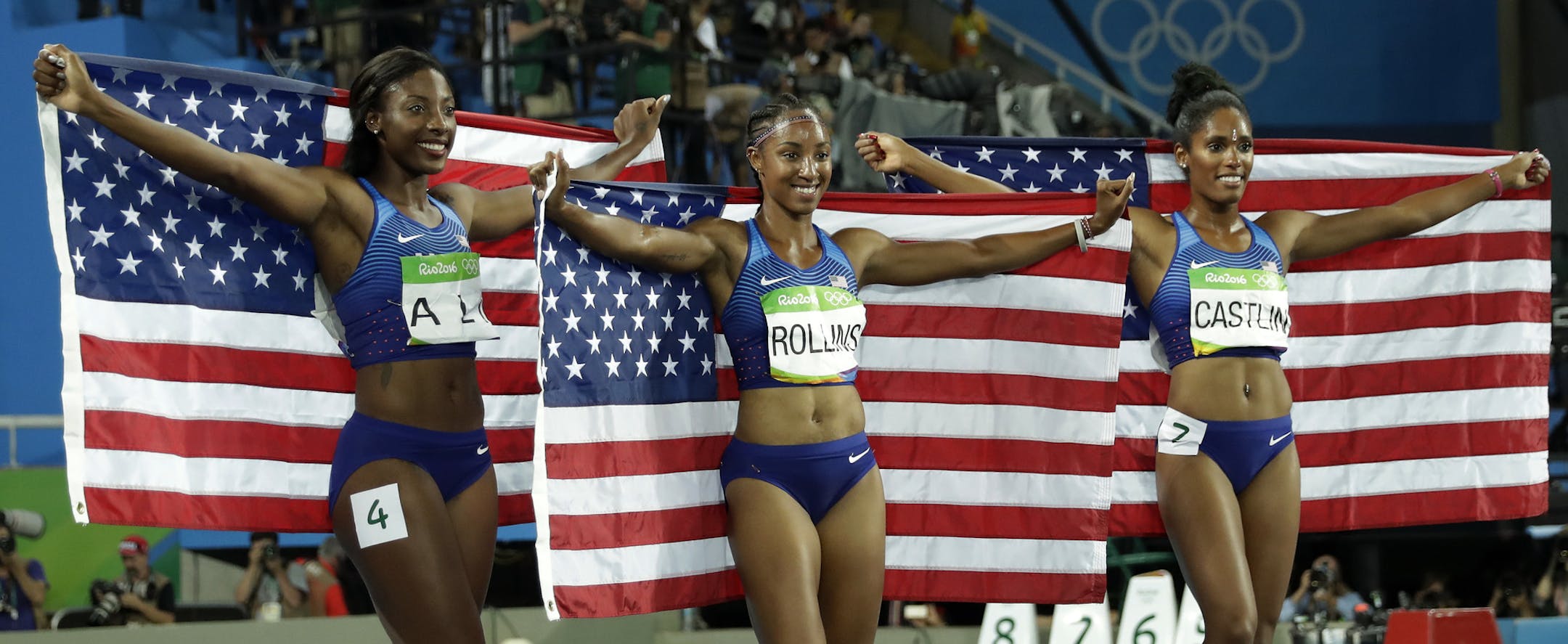Gold medal winner Brianna Rollins, silver medal winner, Nia Ali and bronze medal winner Kristi Castlin, all from the United States, pose with their country's flag after the 100-meter hurdles final, during the athletics competitions of the 2016 Summer Olympics at the Olympic stadium in Rio de Janeiro, Brazil, Wednesday, Aug. 17, 2016. (AP Photo/Matt Dunham) ORG XMIT: OATH798