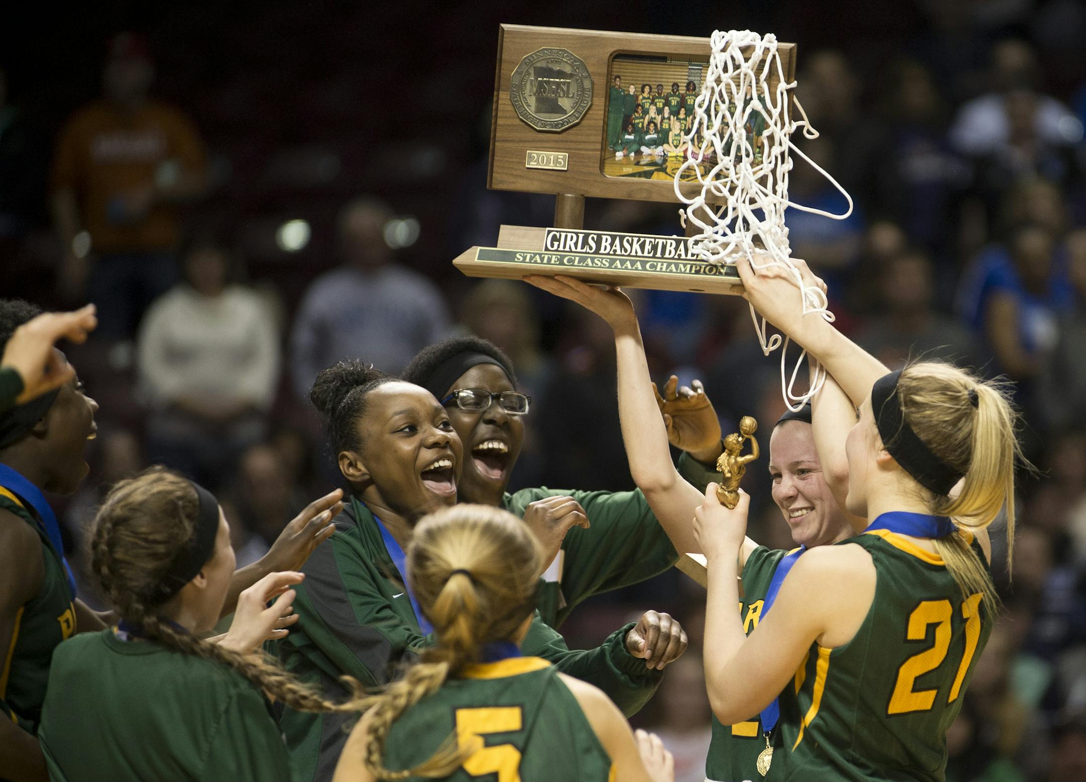 Park Center players celebrate with their championship trophy after defeating Marshall 52-45 in the Class 3A girls' basketball championship game on Saturday night. ] (Aaron Lavinsky | StarTribune) Marshall plays Park Center in the Class 3A girls' basketball championship game on Saturday, March 21, 2015 at Williams Arena. Park Center beat Marshall 52-45.